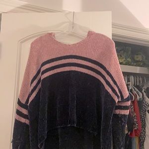 A navy and pink sweater/causal throw on top